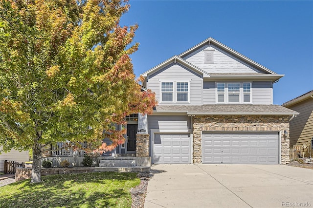 23029 Cleveland Dr, Parker, CO 80138 - view of front of property with an attached garage, concrete driveway, stone siding, a front yard, and a shingled roof