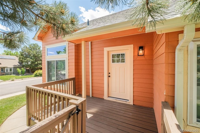 19595 N Mitchell Dr, Denver, CO 80249 - property entrance with a porch and roof with shingles