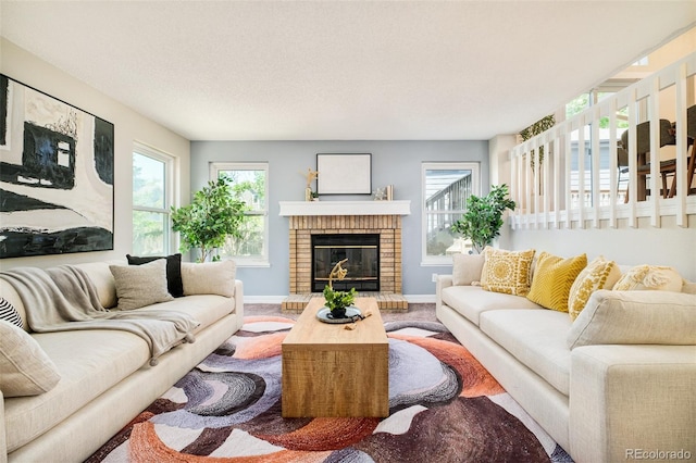 19595 N Mitchell Dr, Denver, CO 80249 - living area featuring a fireplace and plenty of natural light