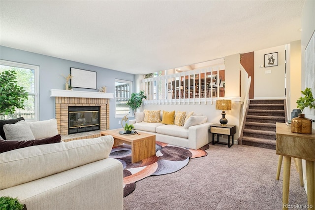 19595 N Mitchell Dr, Denver, CO 80249 - carpeted living area featuring stairway, a fireplace, and a textured ceiling