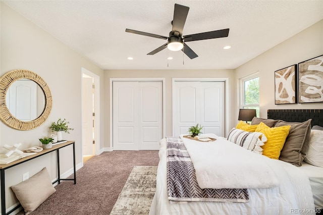19595 N Mitchell Dr, Denver, CO 80249 - carpeted bedroom with two closets, recessed lighting, and ceiling fan