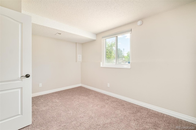 19595 N Mitchell Dr, Denver, CO 80249 - unfurnished room with carpet floors, a textured ceiling, and a smoke detector