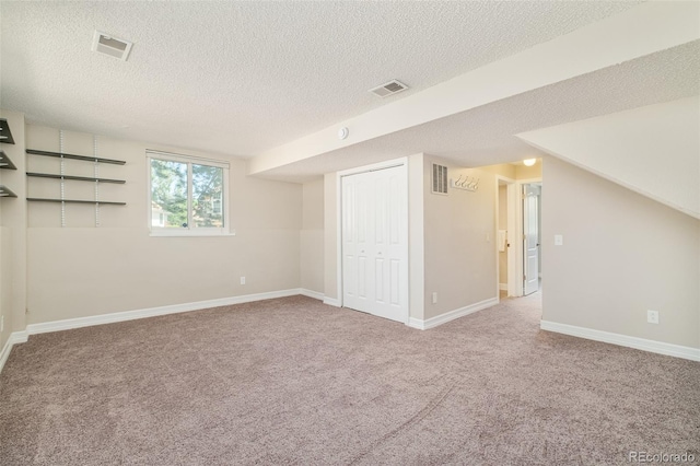 19595 N Mitchell Dr, Denver, CO 80249 - basement with carpet floors and a textured ceiling