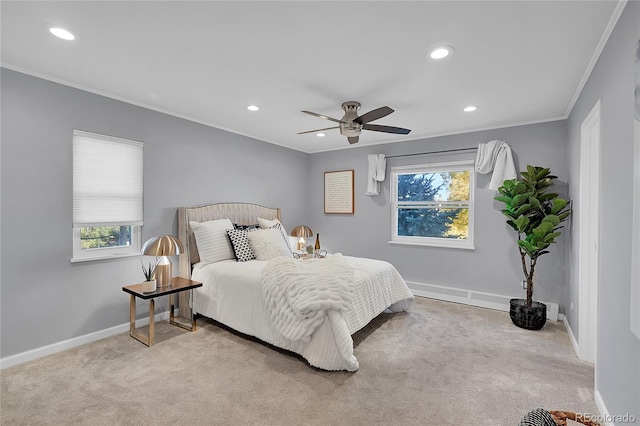 carpeted bedroom featuring multiple windows, crown molding, and ceiling fan