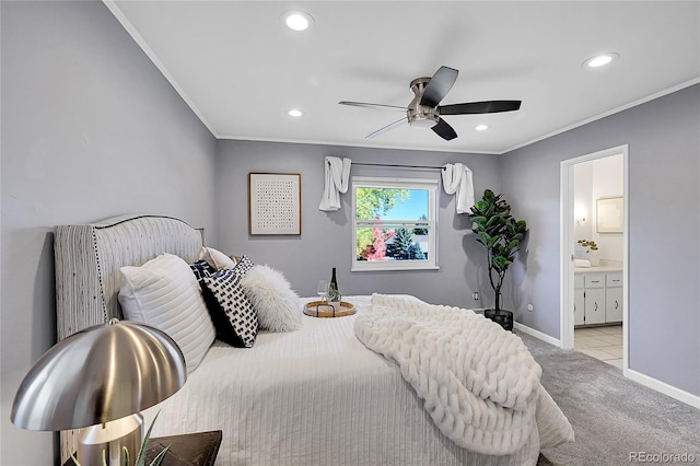 carpeted bedroom with connected bathroom, crown molding, and ceiling fan