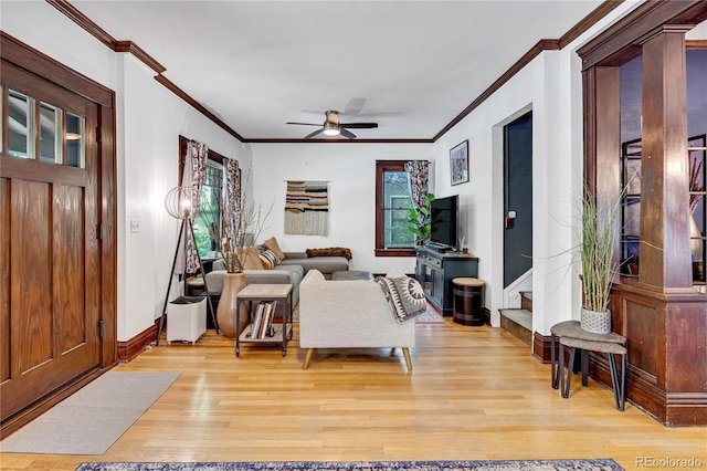 2236 Forest St, Denver, CO 80207 - living room featuring ornamental molding, light wood-style flooring, ceiling fan, and baseboards