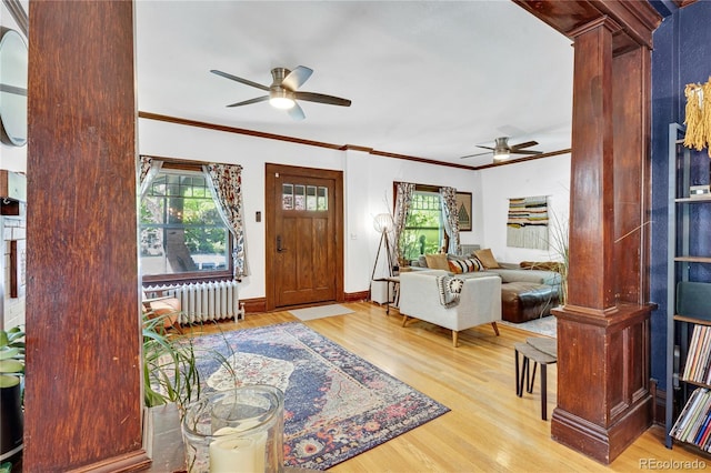 2236 Forest St, Denver, CO 80207 - entrance foyer with radiator, a ceiling fan, healthy amount of natural light, and ornamental molding