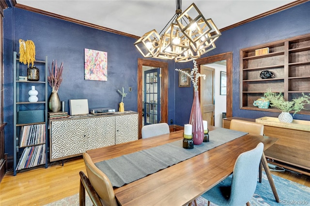 2236 Forest St, Denver, CO 80207 - dining area with ornamental molding, wood finished floors, a chandelier, and a textured wall