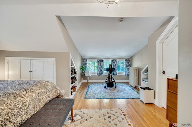 2236 Forest St, Denver, CO 80207 - bedroom featuring radiator, light wood-style flooring, and baseboards