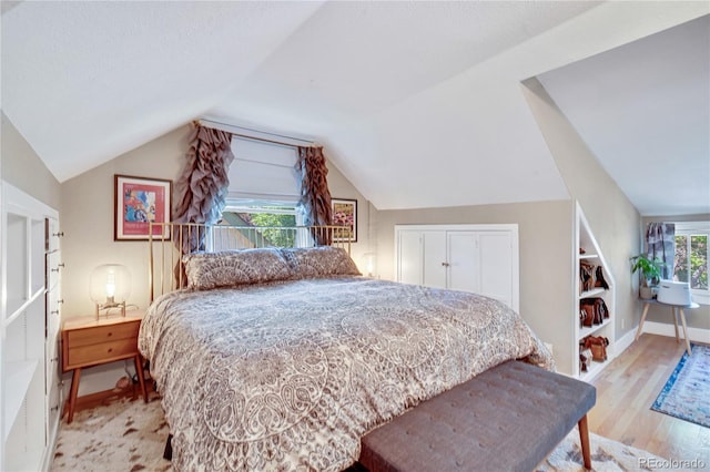 2236 Forest St, Denver, CO 80207 - bedroom featuring lofted ceiling, light wood-type flooring, and baseboards