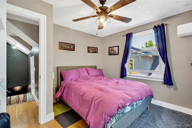 2236 Forest St, Denver, CO 80207 - bedroom with baseboards, a wall unit AC, and a ceiling fan
