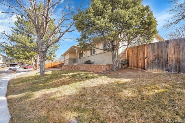 view of side of property featuring a lawn