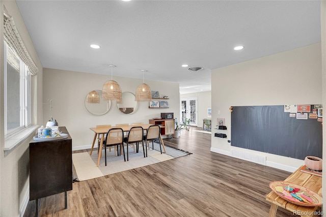 dining space featuring hardwood / wood-style floors