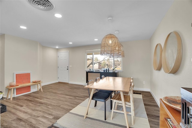 dining room featuring wood-type flooring