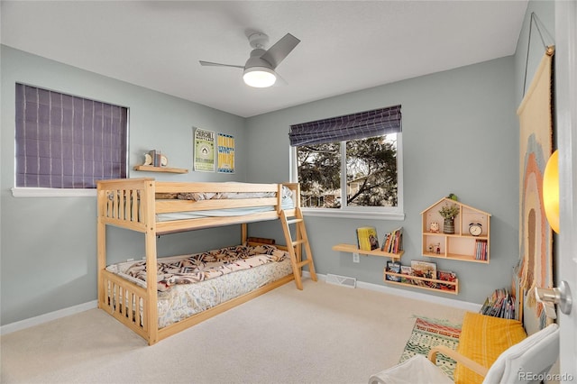 bedroom featuring ceiling fan and carpet