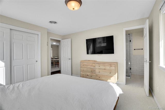 carpeted bedroom with ensuite bath