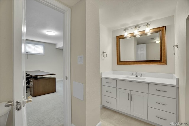 bathroom with vanity and a textured ceiling