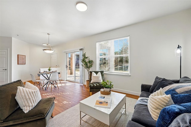 12924 Ironstone Way Unit 103, Parker, CO 80134 - living room with baseboards and wood finished floors