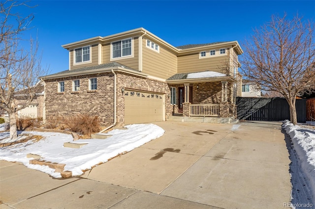 view of front of home featuring a garage and covered porch