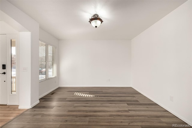 empty room featuring dark hardwood / wood-style floors