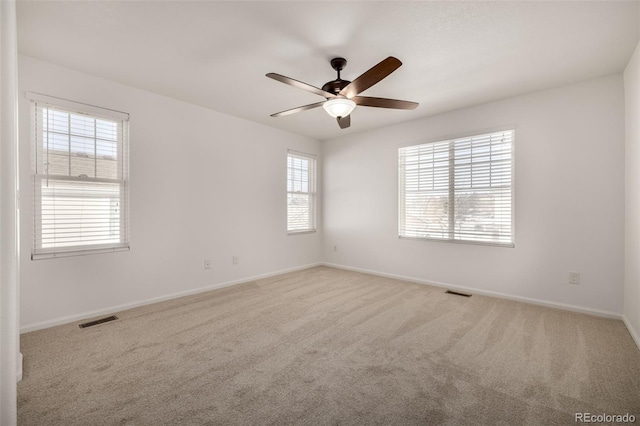 carpeted empty room with ceiling fan