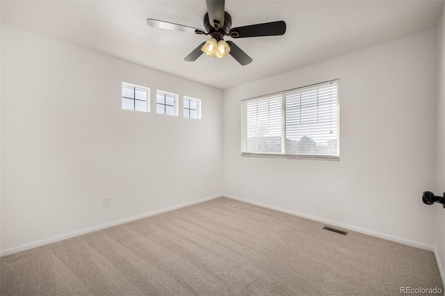 empty room featuring ceiling fan and carpet flooring