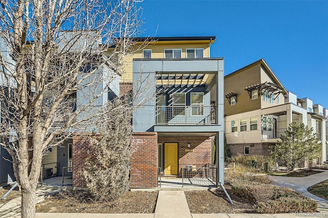 view of front of house with brick siding