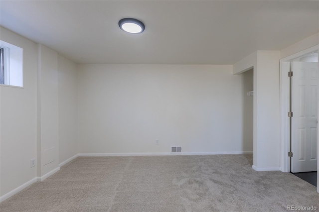 unfurnished bedroom featuring baseboards, visible vents, and carpet flooring