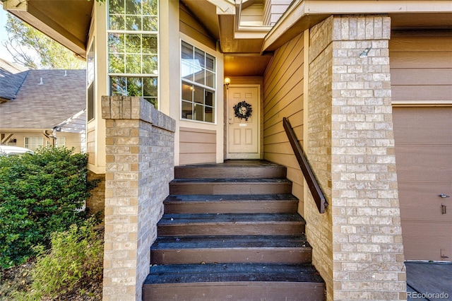 doorway to property featuring a garage