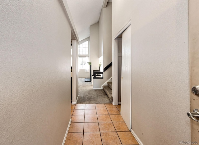 hallway featuring light tile patterned flooring