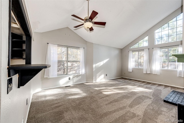 unfurnished living room with ceiling fan, carpet flooring, and vaulted ceiling