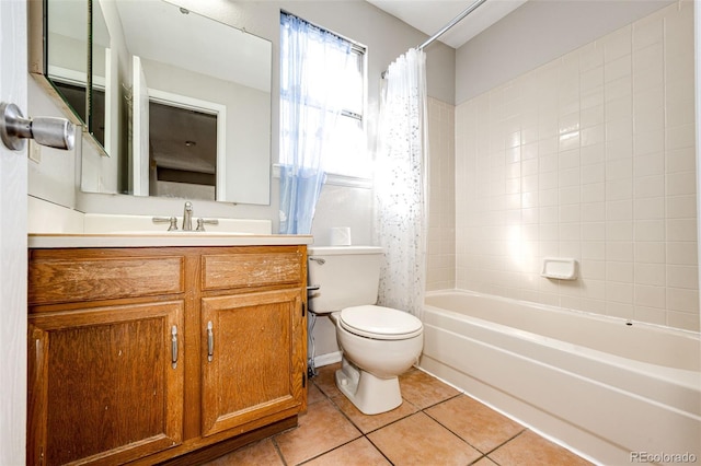 full bathroom featuring vanity, shower / bath combo with shower curtain, toilet, and tile patterned flooring