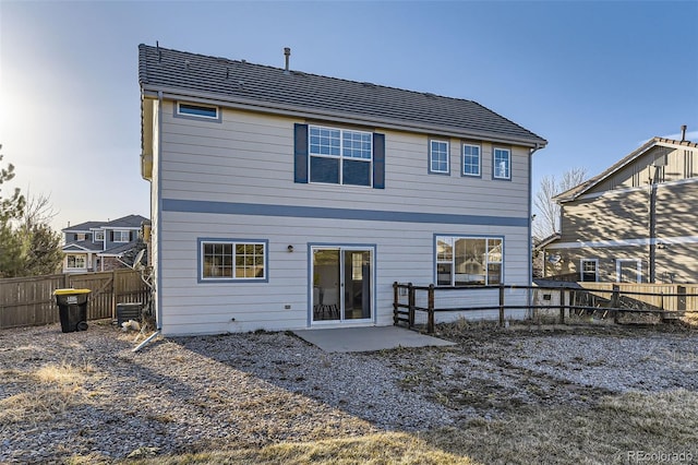 back of house featuring a patio and a fenced backyard