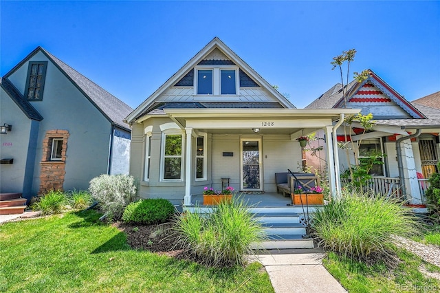 1208 S Pennsylvania St, Denver, CO 80210 - view of front of property featuring a porch