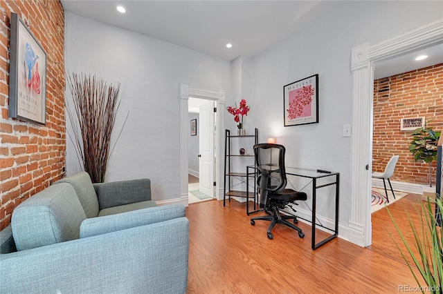 1208 S Pennsylvania St, Denver, CO 80210 - office space featuring brick wall, light wood-type flooring, recessed lighting, and baseboards