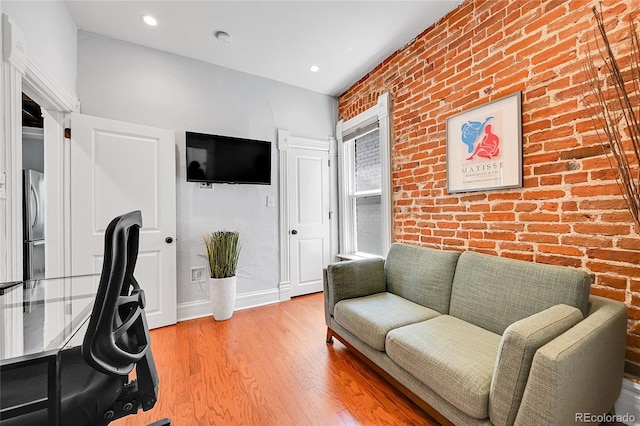 1208 S Pennsylvania St, Denver, CO 80210 - office featuring brick wall, wood finished floors, baseboards, and recessed lighting
