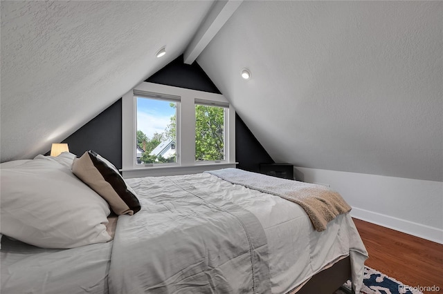 1208 S Pennsylvania St, Denver, CO 80210 - bedroom with wood finished floors, baseboards, and a textured ceiling