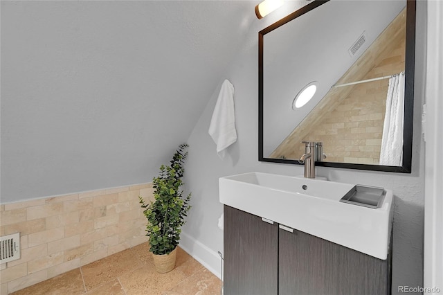 1208 S Pennsylvania St, Denver, CO 80210 - full bathroom with vanity, a shower with curtain, and baseboards
