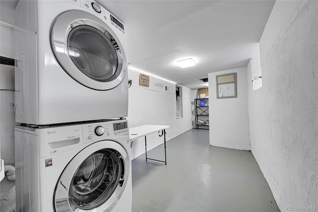 1208 S Pennsylvania St, Denver, CO 80210 - laundry room featuring estacked washer and dryer and a textured wall