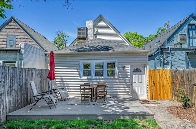 1208 S Pennsylvania St, Denver, CO 80210 - back of property with a deck, roof with shingles, and cooling unit