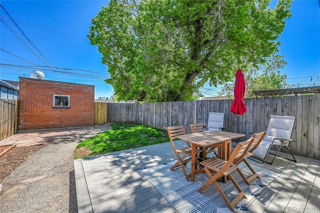 1208 S Pennsylvania St, Denver, CO 80210 - deck featuring a fenced backyard and outdoor dining space