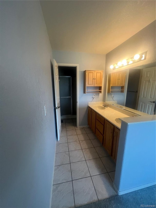 bathroom featuring tile patterned floors and double sink