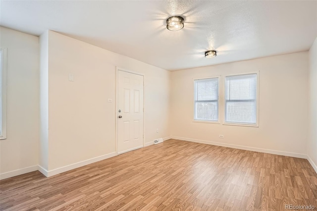 empty room featuring light hardwood / wood-style floors