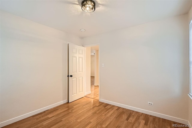 spare room featuring light hardwood / wood-style floors