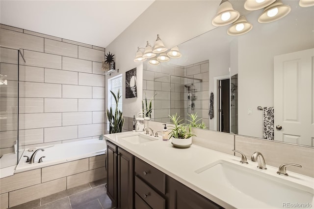 bathroom featuring vanity, tile patterned floors, and plus walk in shower