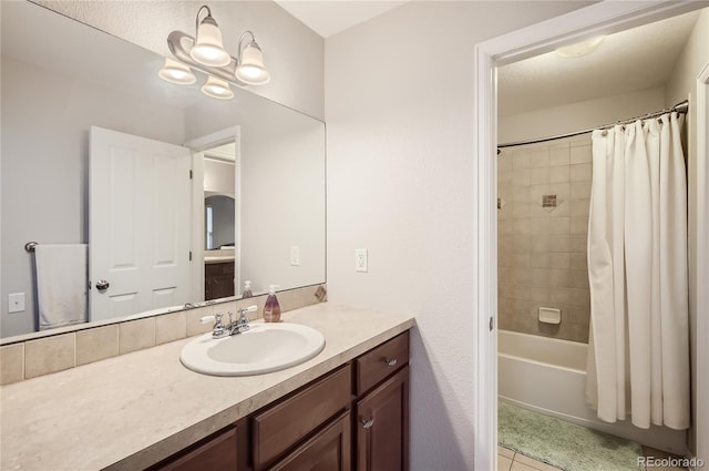 bathroom with tile patterned floors, vanity, and shower / bathtub combination with curtain