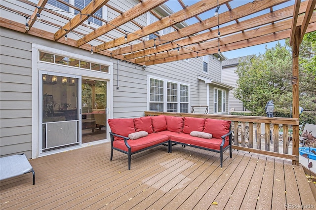 wooden deck with an outdoor living space and a pergola