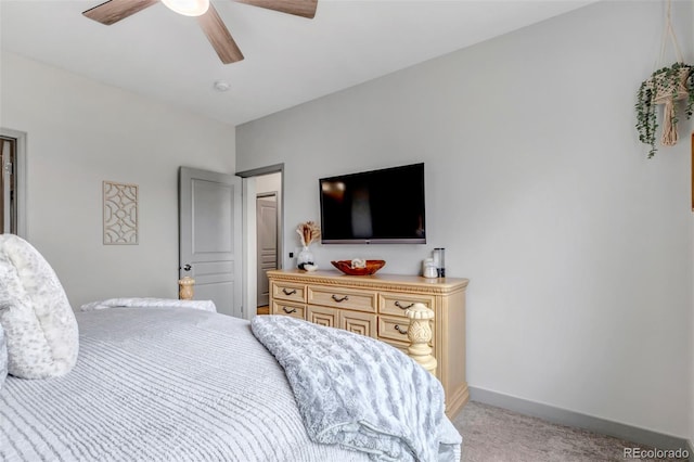 837 E 98th Ave Unit 403, Thornton, CO 80229 - bedroom with light carpet, baseboards, and a ceiling fan