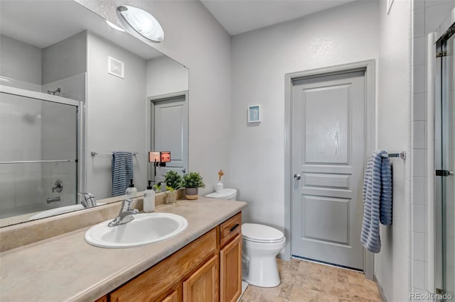 837 E 98th Ave Unit 403, Thornton, CO 80229 - full bath with an enclosed shower, vanity, toilet, and stone finish flooring