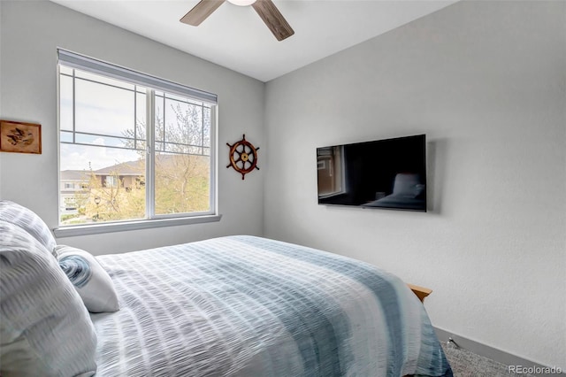 837 E 98th Ave Unit 403, Thornton, CO 80229 - bedroom featuring a ceiling fan and baseboards